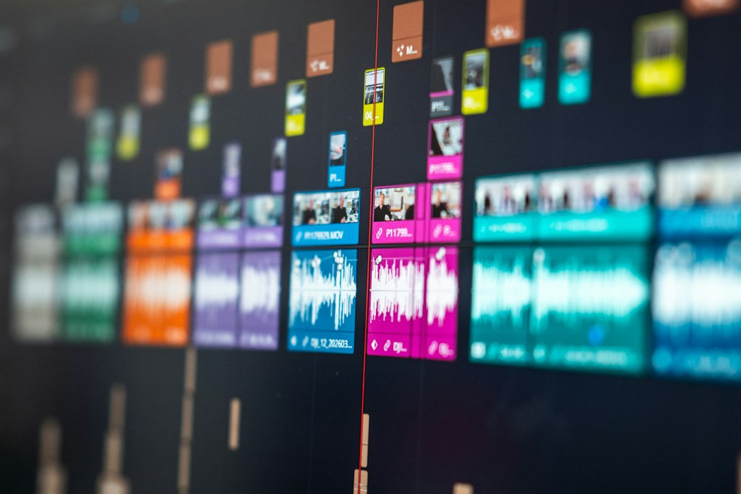 Colorful video editing timeline with audio waveforms and video clips